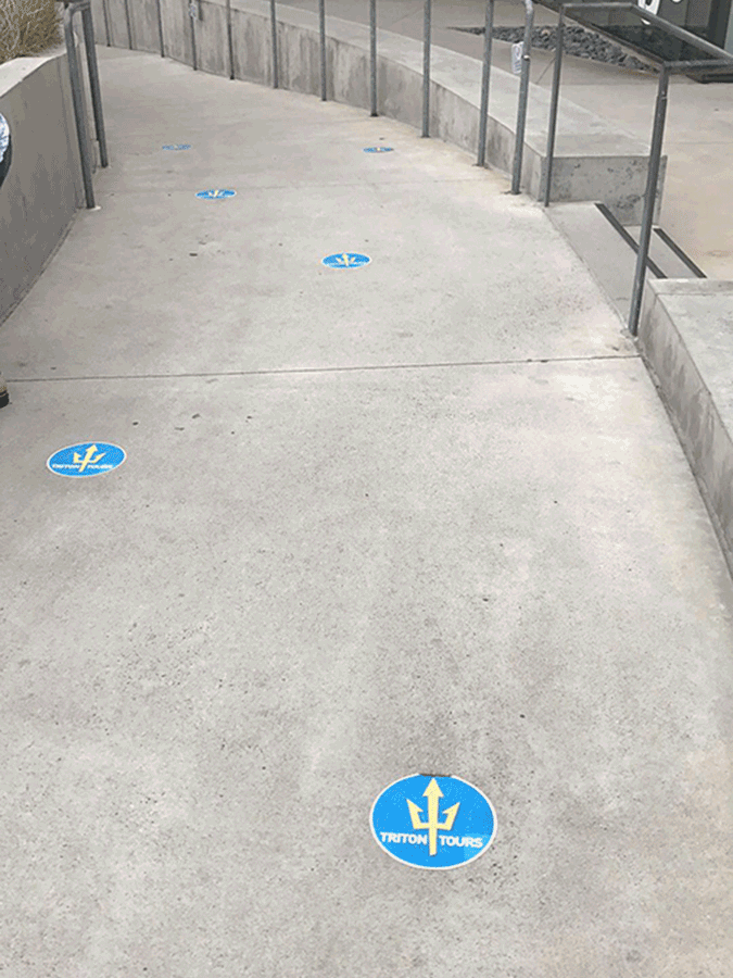 stickers on concrete, in sequence, to show a walkway